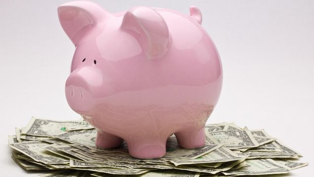 PIck piggy bank. Save money first to stop living paycheck to paycheck.